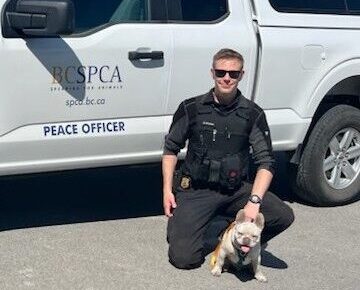 Photo of Cst. Victor & Bronson (dog).