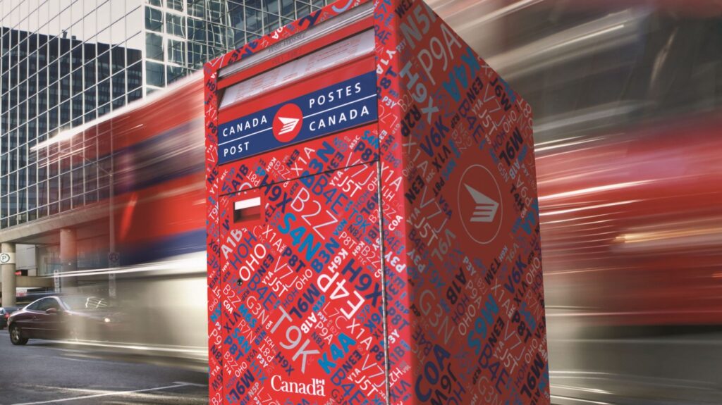 Canada Post mailbox on a city sidewalk